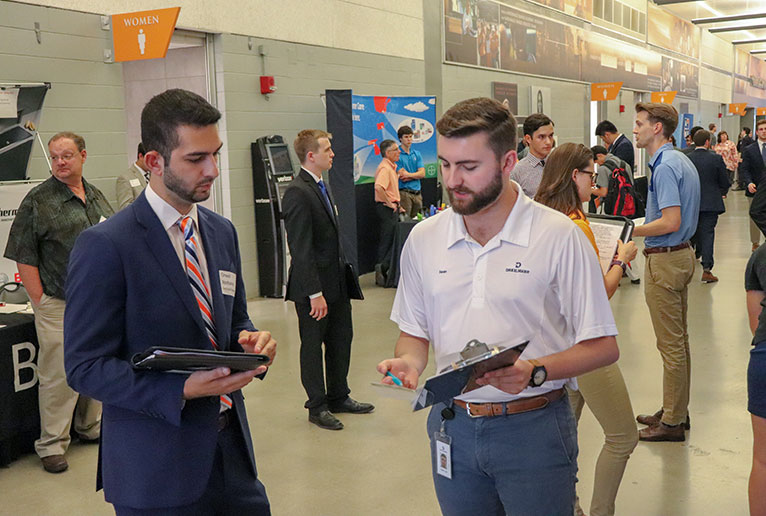 Student Talks with Representative at the Engineering Expo