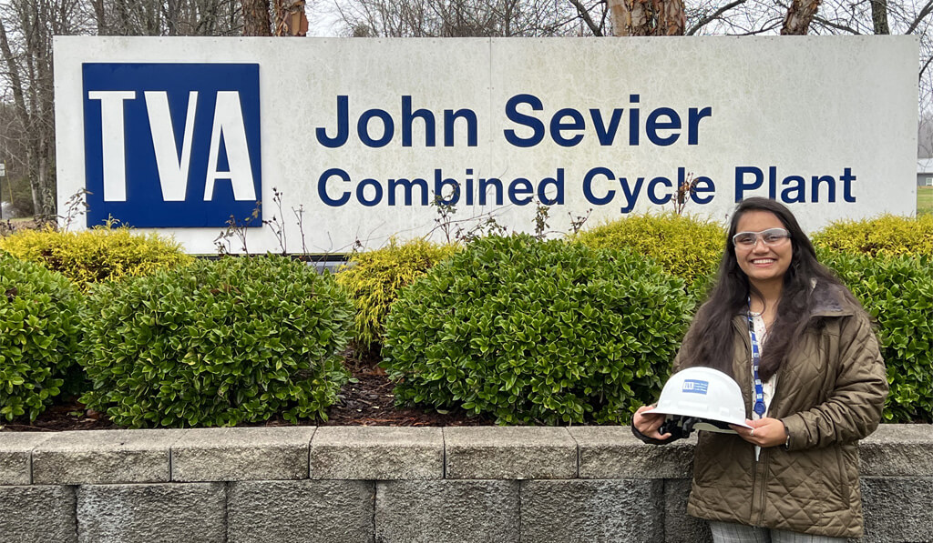 Riya Patel standing in front of John Sevier Combined Cycle Plant