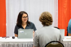 Eastman representatives interviewing a male student at Interview Day