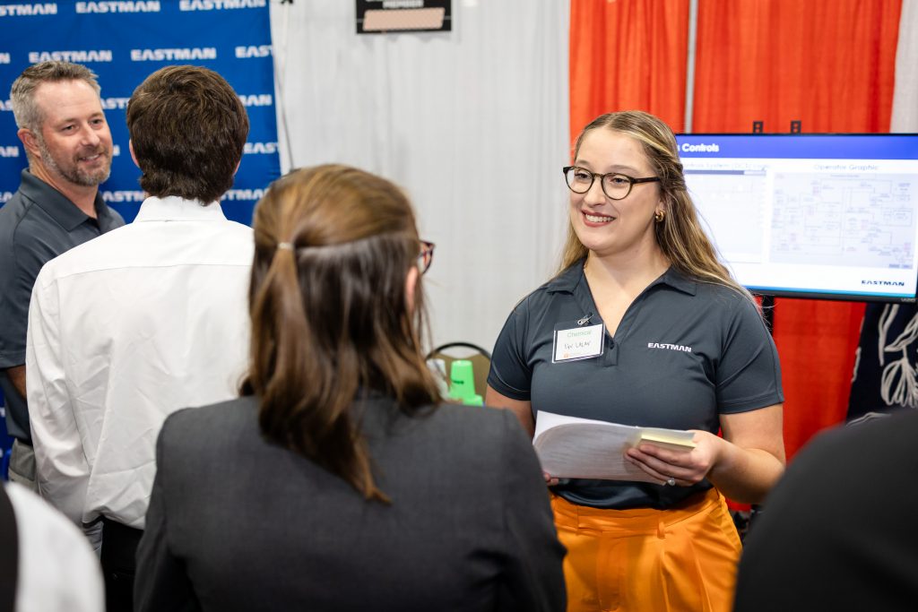 Eastman recruiter talking to female student at the Engineering Expo