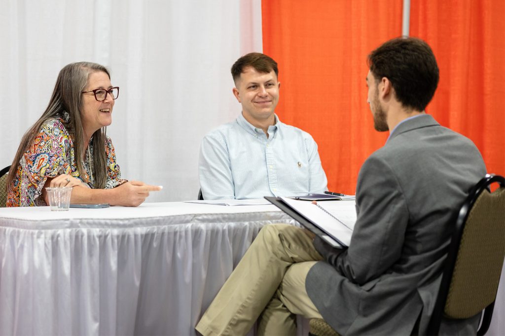 student being interviewed by a company at the Engineering Expo