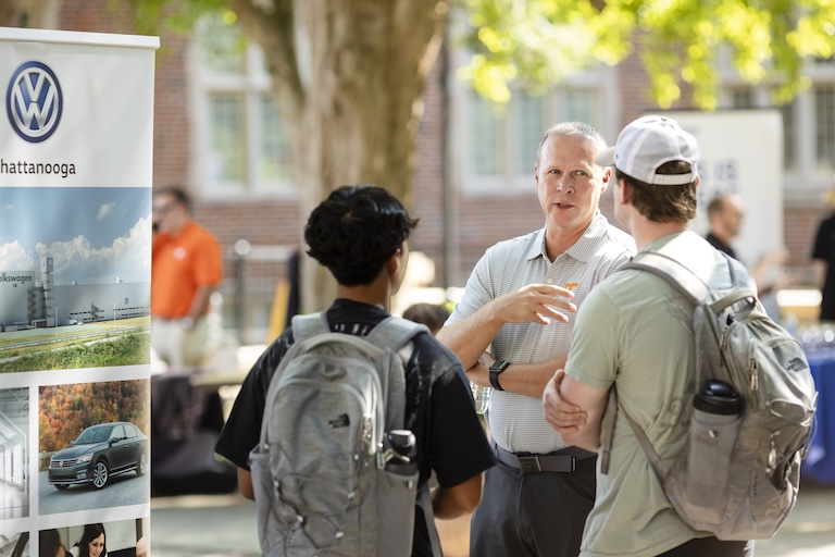 Volkswagen speaking to students at the engineering cookout